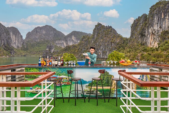 Full Day Halong Bay Luxury Limousine Bus & Buffet Lunch - Hang Luon Cave: kayaking or bamboo boat on calm water