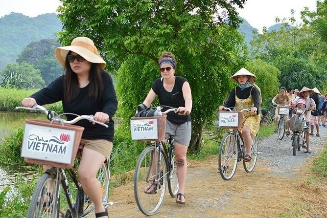 Full day Hoa Lu, Tam Coc and Mua Cave by Limousine from Hanoi - Tam Coc by bamboo boat: paddy fields, caves, and the 1.5-hour rhythm